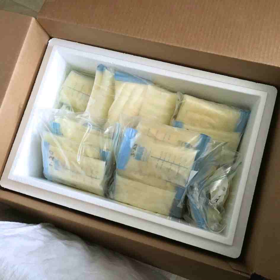 box of frozen breastmilk pumped by a surrogate mother
