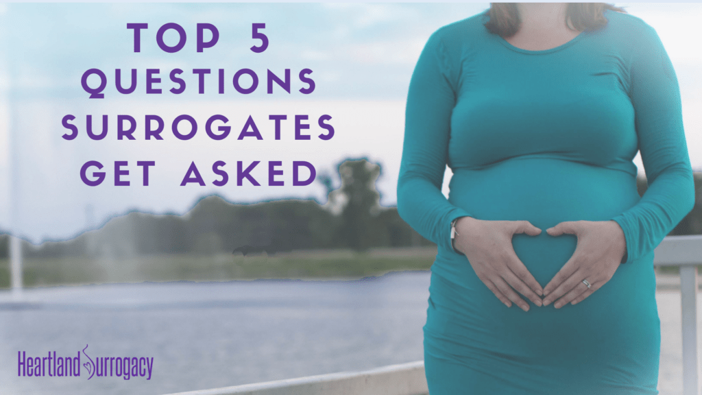 Pregnant person with hands forming a heart on belly: Top 5 Common Questions People Ask Surrogates