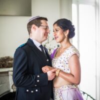 bipoc mother through surrogacy dancing with husband