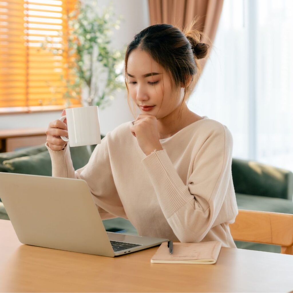 asian surrogate reviewing surrogacy insurance policies online